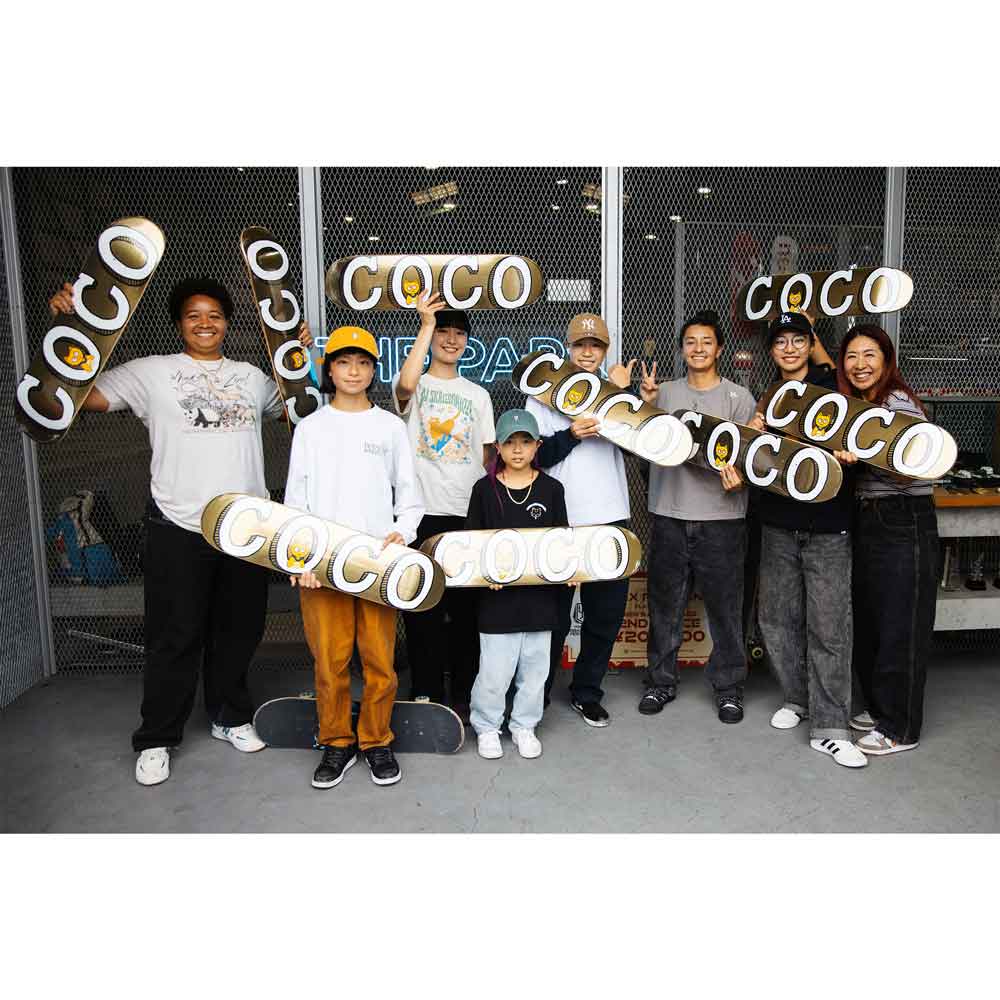 Meow Skateboards team holding gold 'COCO' skateboard decks