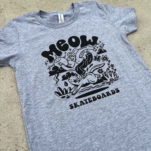 Gray t-shirt with black graphic design and 'MEOW SKATEBOARDS' text on a concrete surface